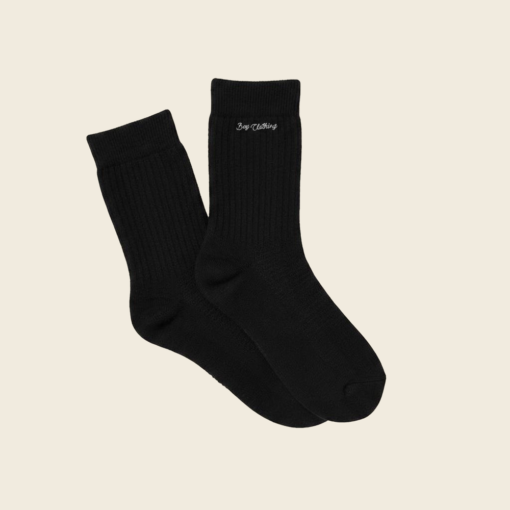 Black men’s cotton crew socks by Bay Clothing with ribbed design and minimal logo detail
